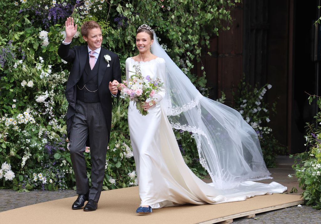 Hugh Grosvenor, Duke of Westminster and Olivia Grosvenor, Duchess of Westminster wave and smile to well-wishers after their wedding ceremony at Chester.