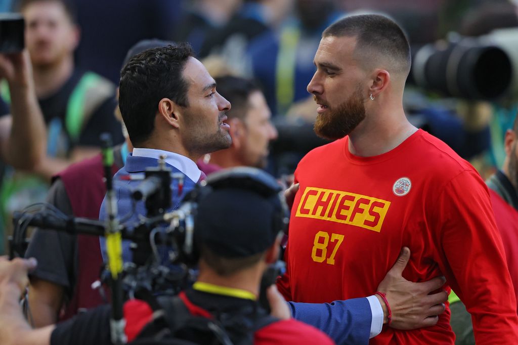 Former NFL player Mark Sanchez greets Travis Kelce #87 of the Kansas City Chiefs prior to Super Bowl LIV against the San Francisco 49ers at Hard Rock Stadium on February 02, 2020