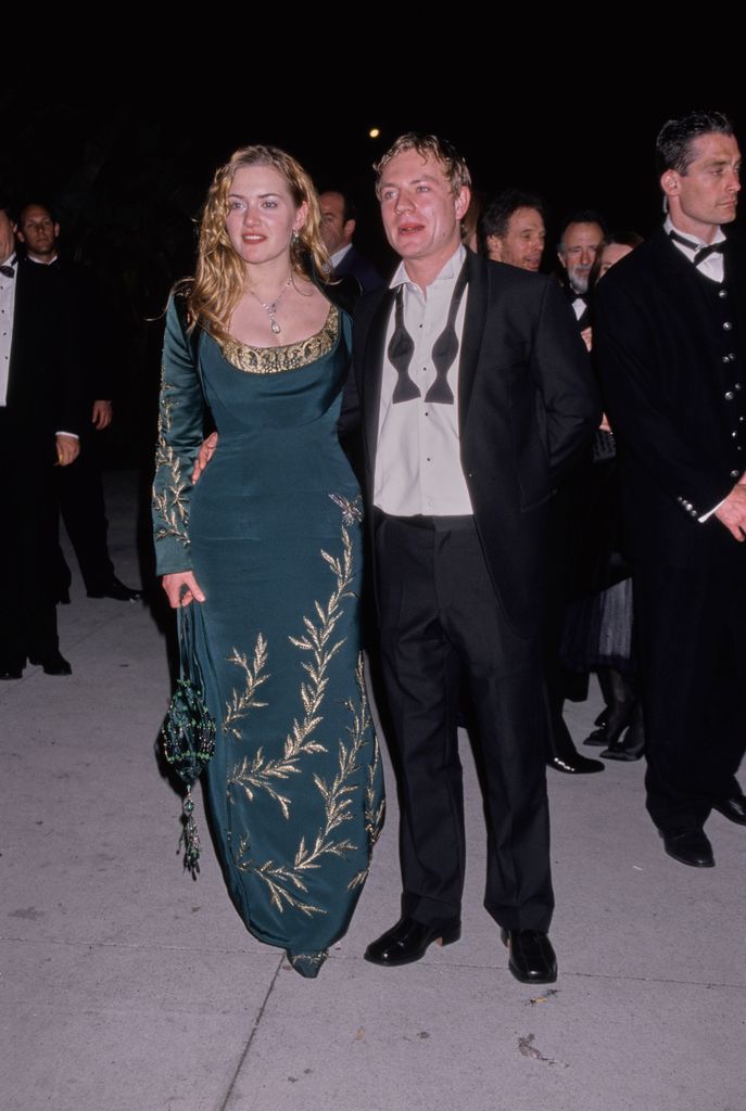 Kate Winslet in a green gown alongside Jim Threapleton in tux