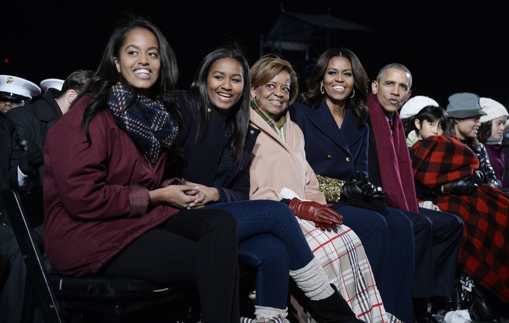 Malia Obama, Sasha Obama, mother-in-law Marian Robinson, first lady Michelle Obama and President Barack Obama sat together smiling