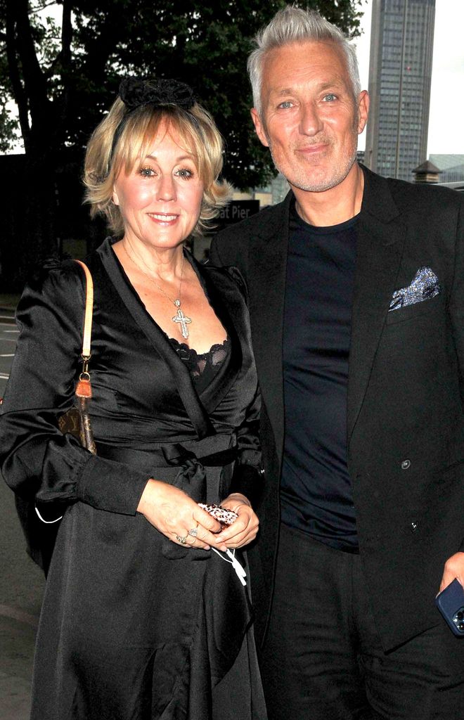 Shirlie Kemp in a black dress with Martin Kemp next to a London road