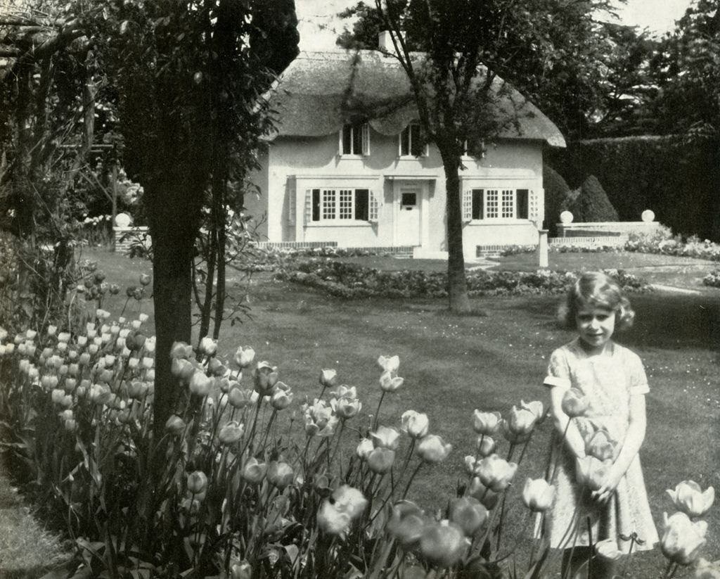 young girl standing in front of Wendy house