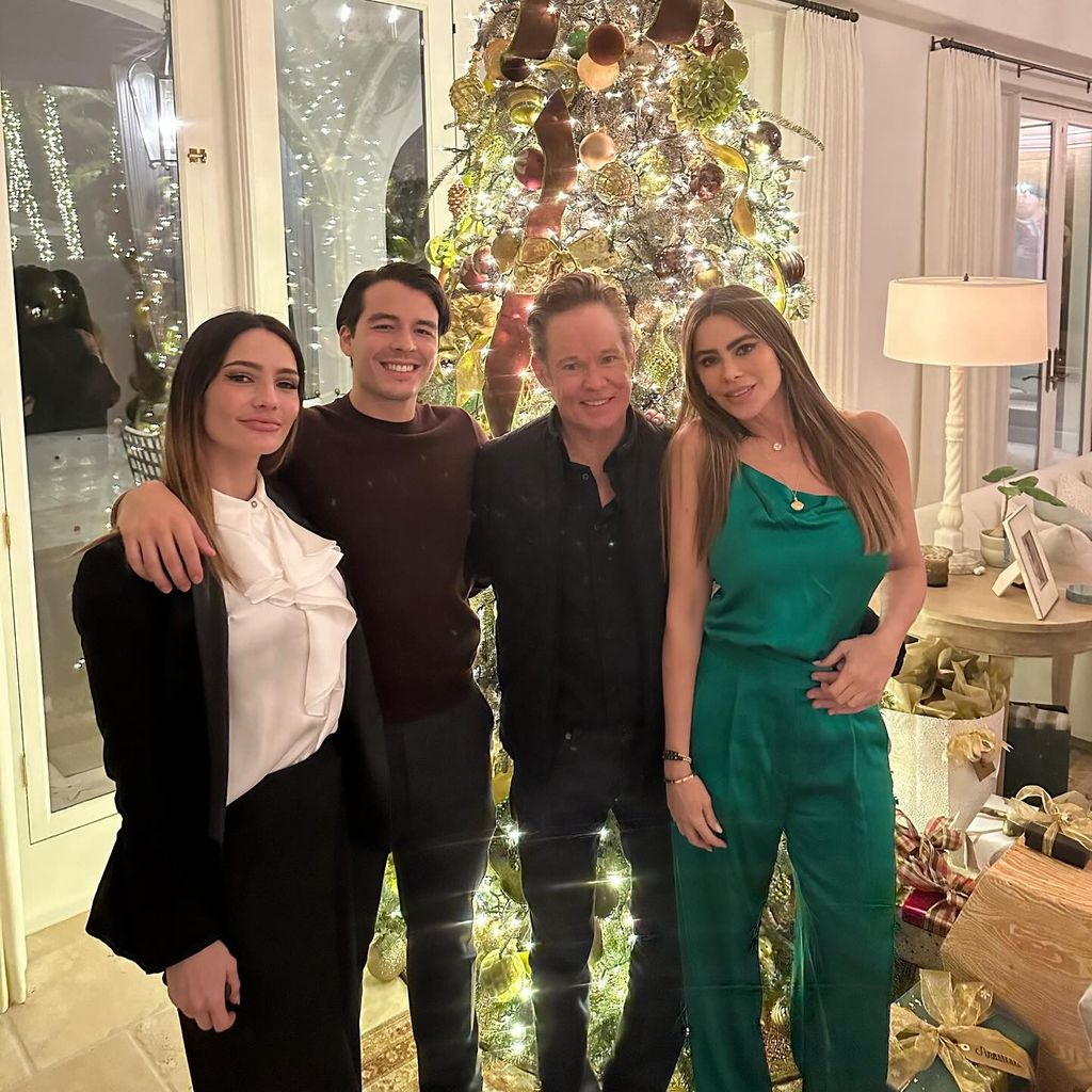 Sofia with friends by christmas tree