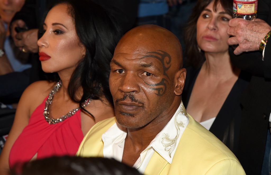 Kiki and Mike Tyson watching a boxing match