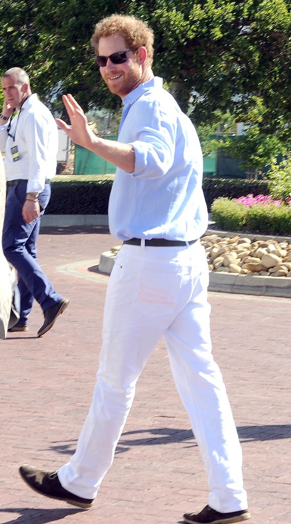 Prince Harry in a white outfit at a polo match