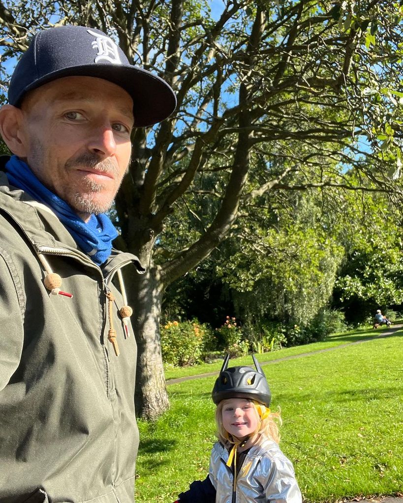 Jonnie irwin outside in park with son rex 