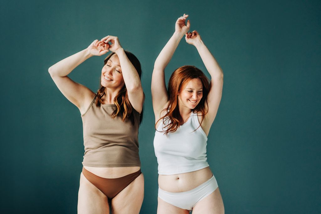 Two females in lingerie and vest with different body shape.