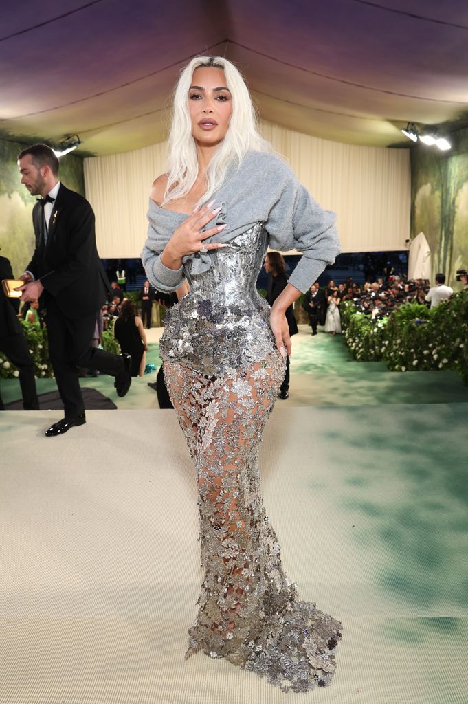 Kim Kardashian wore a breathtakingly slim waist encased in a shimmering silver corset by Maison Margiela