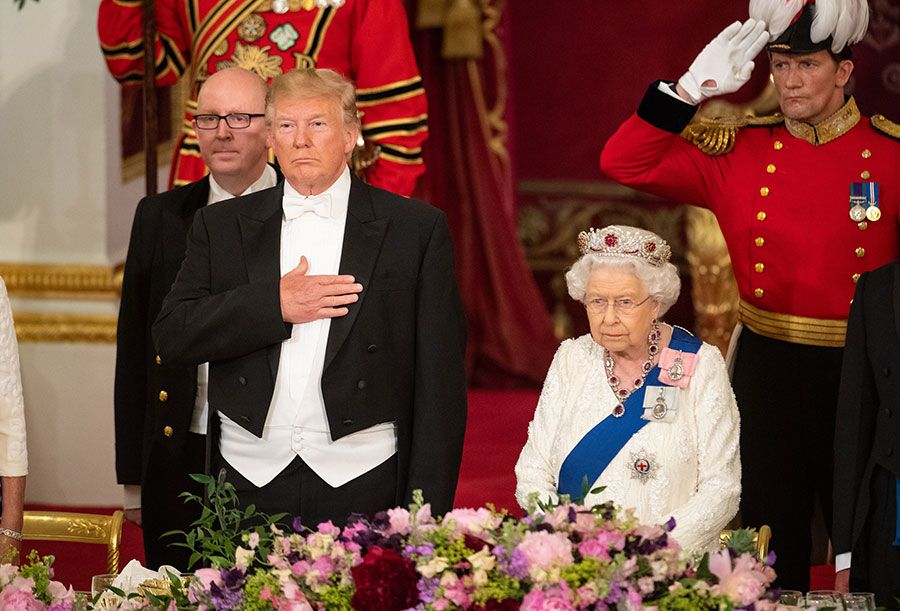donald trump seated next to the queen