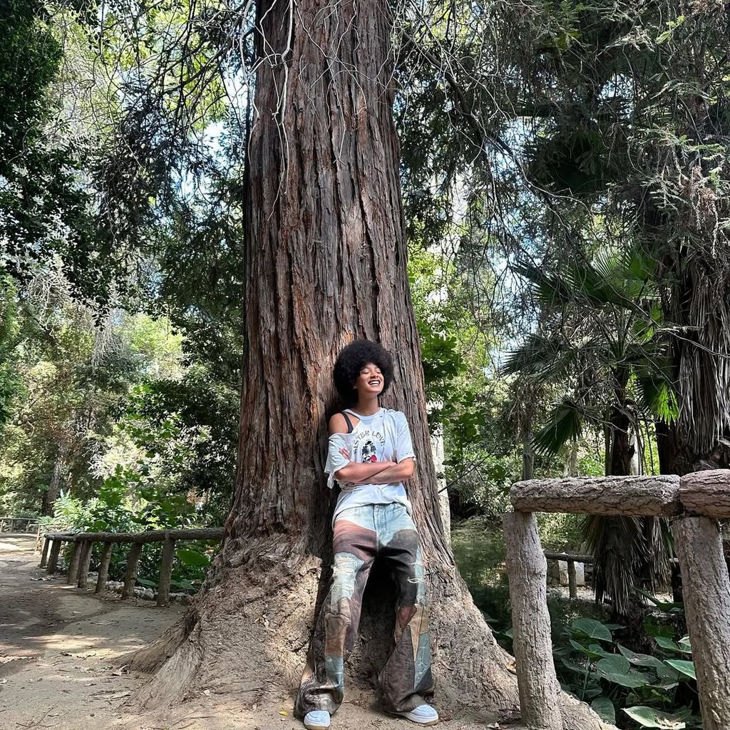 Willow Smith leans against a tree for a photo shared on Instagram
