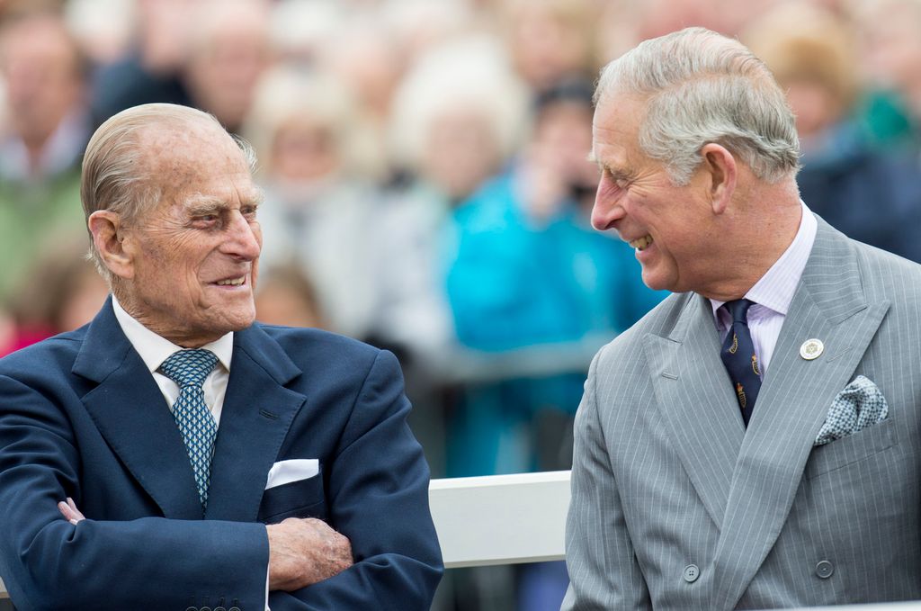 King Charles and Prince Philip sharing a laugh 