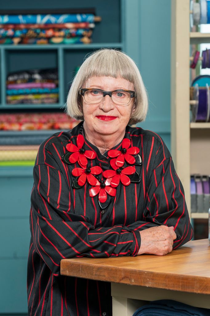 Esme Young in a black and red striped shirt