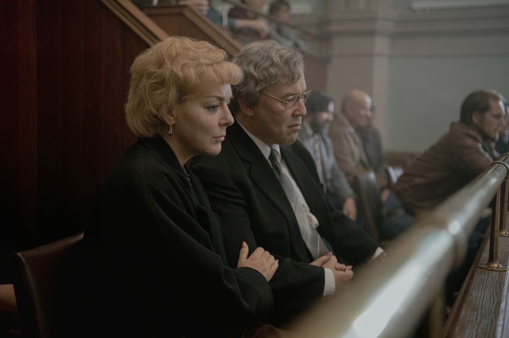 A couple sits in court