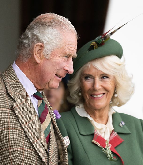 king charles and queen consort camilla at the braemar games wearing tweed and smiling 