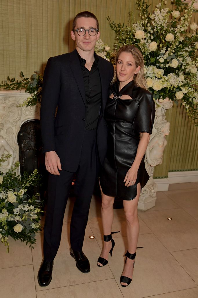 couple in black clothes at vogue event 
