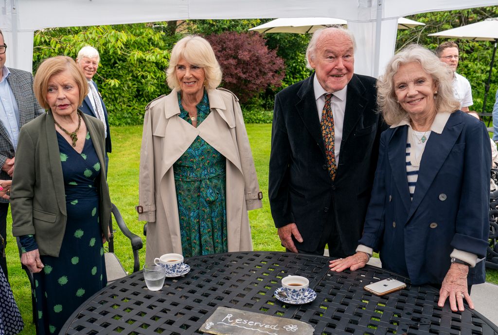 Queen Camilla is seen meeting Prunella Scales (L), actor Timothy West (2R) and Oscar winner Hayley Mills (R) during a garden party at Lamb House