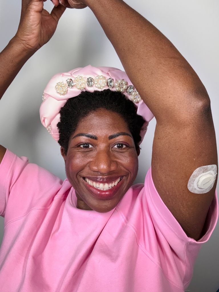 woman with a diabetes monitor on her arm 