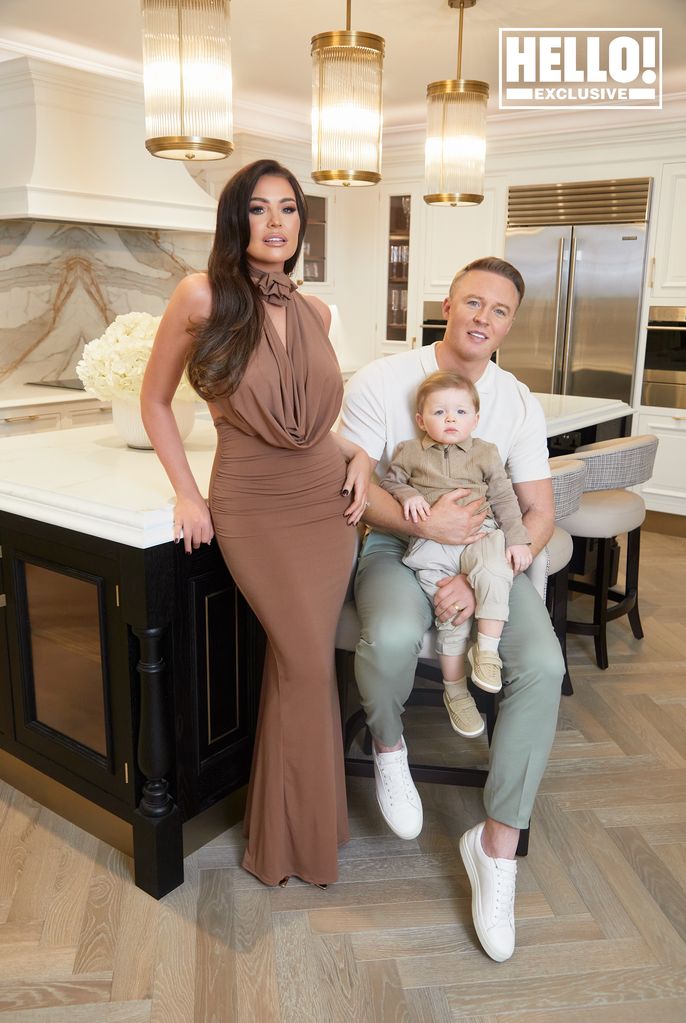 Jessica Wright posing in kitchen of home with husband William Lee-Kemp and son Presley