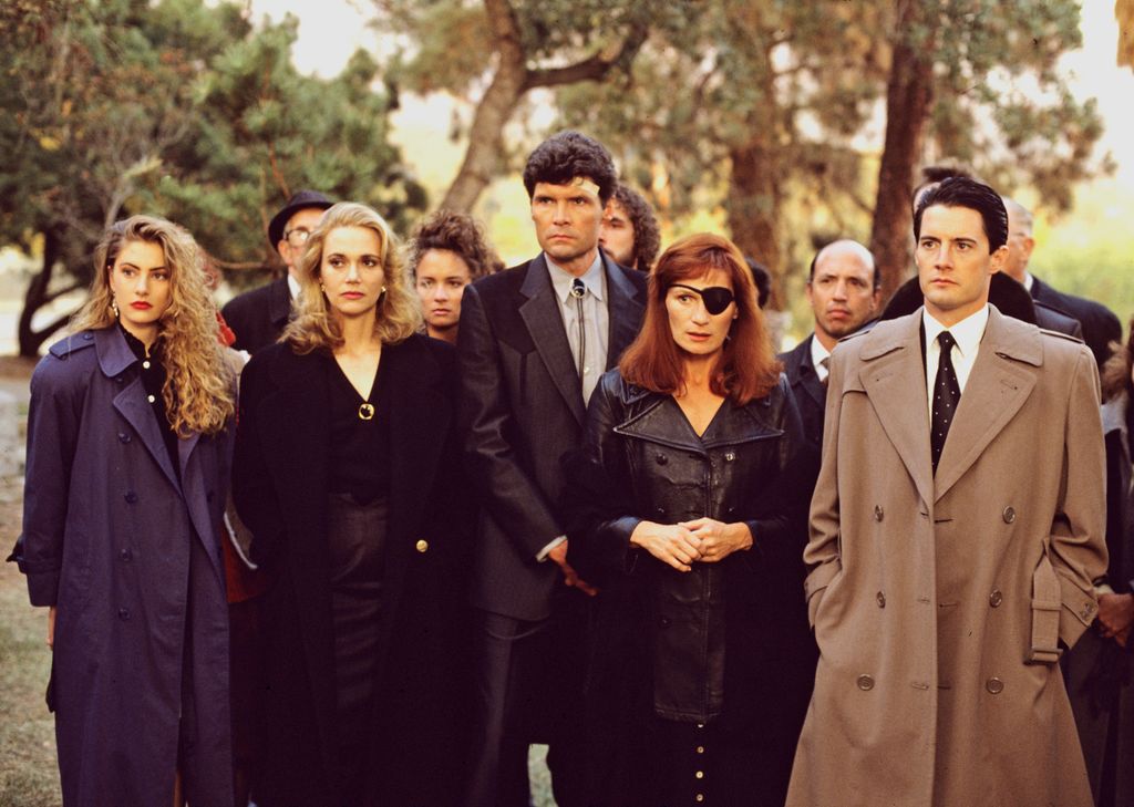 UNITED STATES - APRIL 26:  TWIN PEAKS - Episode Three - Season One - 4/26/1990, FBI Special Agent Dale Cooper (Kyle MacLaughlin, right) at former homecoming queen Laura Palmer's funeral with a lineup of mourners/suspects, from left: Shelly Johnson (Madchen Amick), Norma Jennings (Peggy Lipton), Ed Hurley (Everett McGill) and Nadine Hurley (Wendy Robie).,  (Photo by ABC Photo Archives/Disney General Entertainment Content via Getty Images)