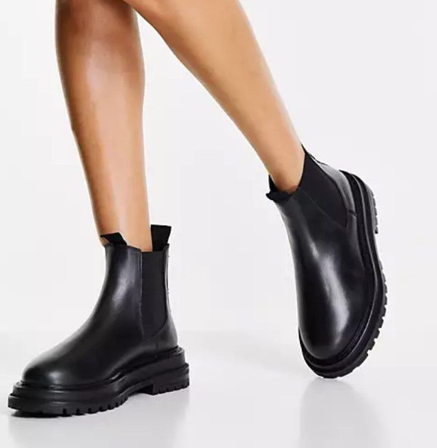 asos model legs wearing chelsea wide fit leather boots