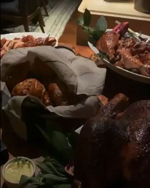 a still image from a video of a table filled with thanksgiving food