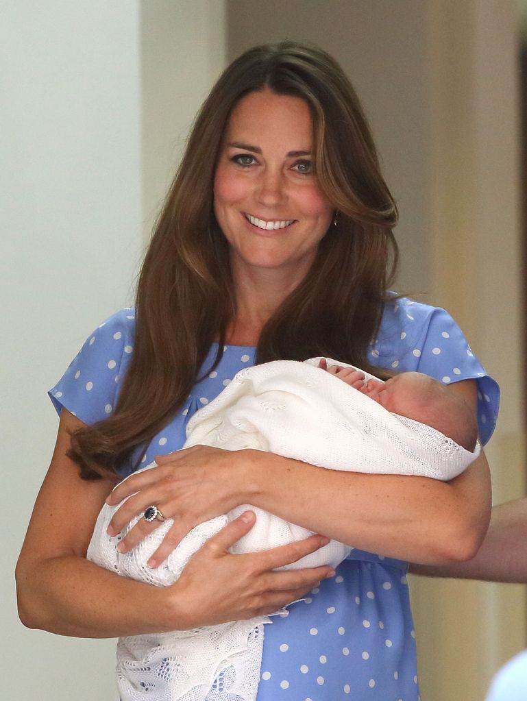 Princess Kate carrying a baby Prince George