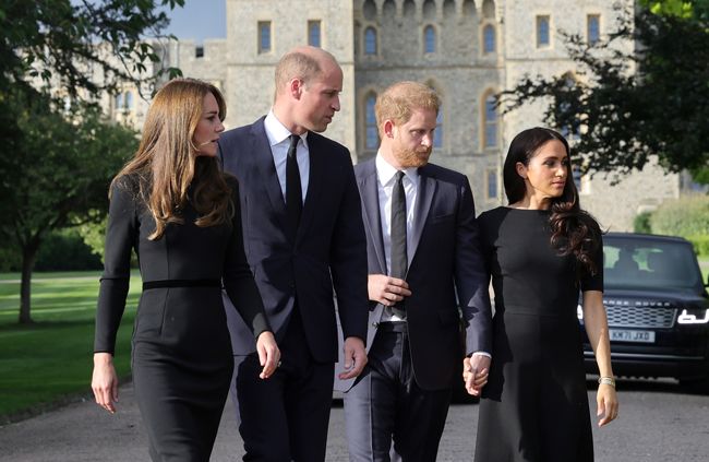 kate middleton, meghan markle, prince harry and prince william on a walkabout dressed in black