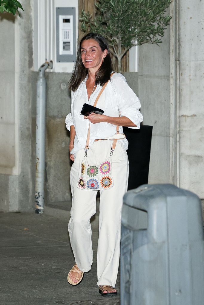 Queen Letizia wearing white outfit and crochet bag