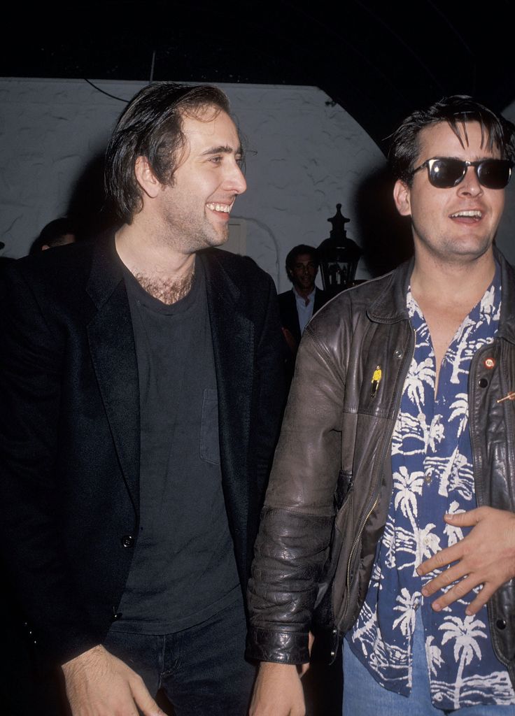 Nicolas Cage and actor Charlie Sheen on June 16, 1990 party at Bar One Nightclub in West Hollywood, California