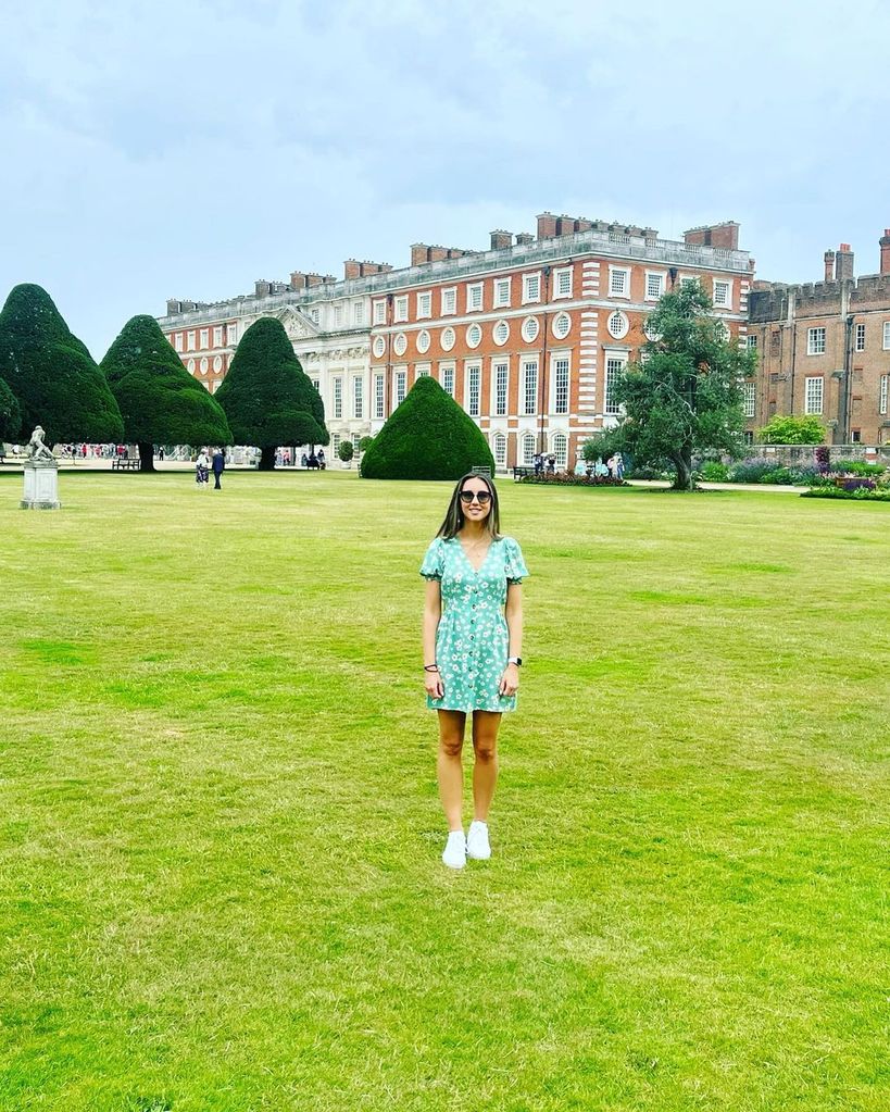 Emily Andre wears a green floral mini dress outside Hampton Court Palace
