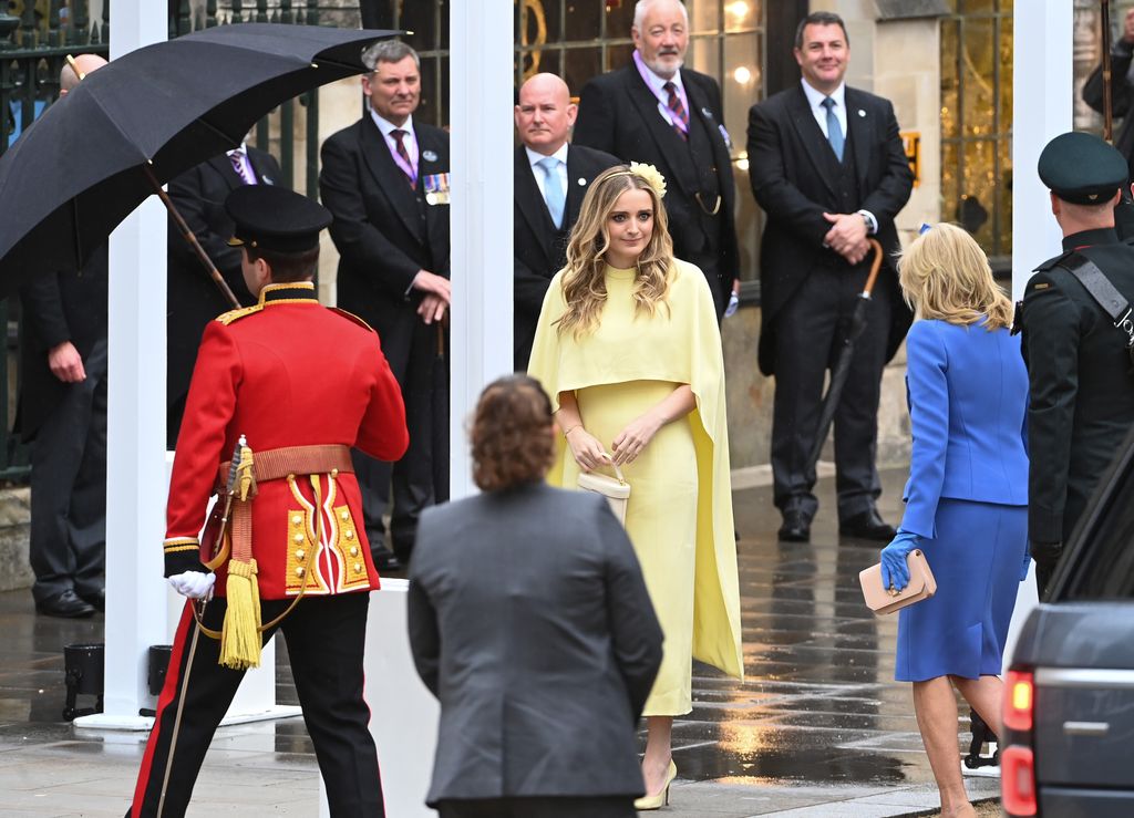 Finnegan Biden wears a gorgeous yellow dress as she arrives at the Coronation of King Charles III and Queen Camilla alongside grandmother Jill