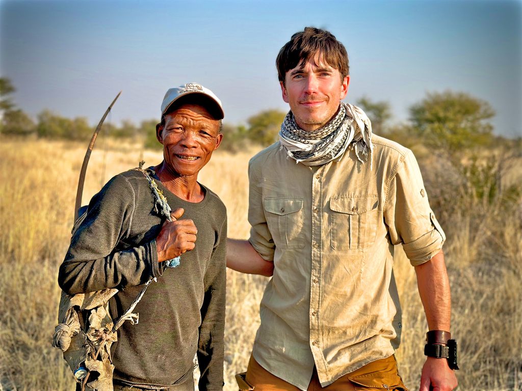 Simon Reeve with San hunter Tui in the Kalahari in Wilderness with Simon Reeve
