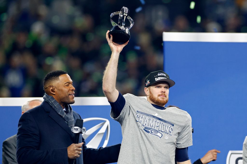 Sam Darnold #14 of the Seattle Seahawks reacts after the NFC Championship game against the Los Angeles Rams on January 25, 2026 at Lumen Field in Seattle, Washington