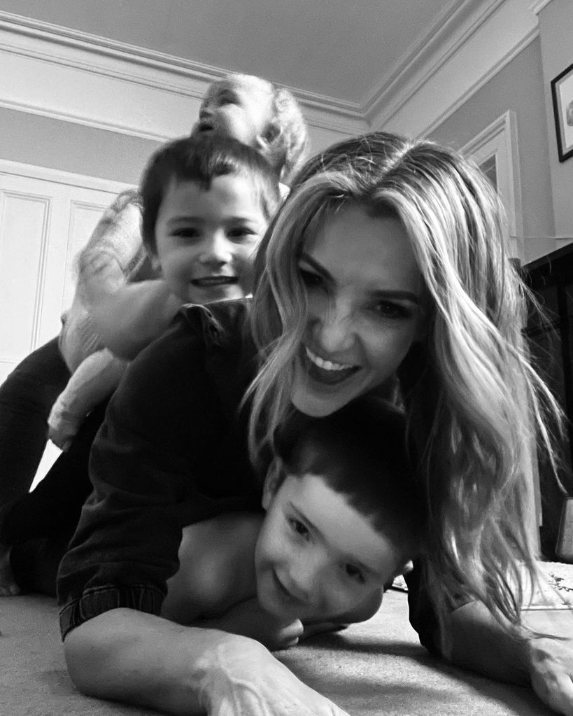 Helen playing with her three children