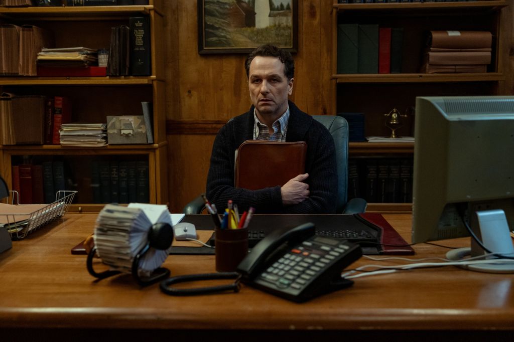 man holding folder in office
