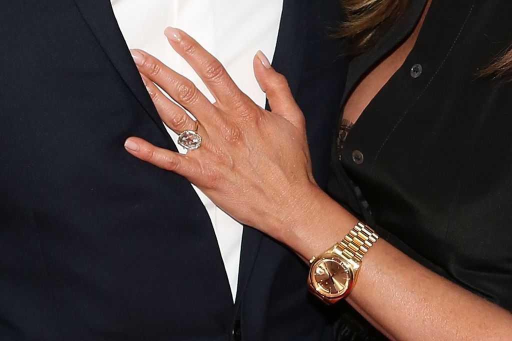 Jennifer Aniston hand up close with big diamond ring and gold watch