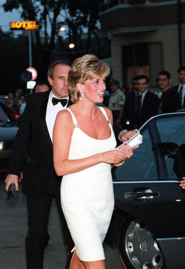 Diana exiting car in white Versace dress