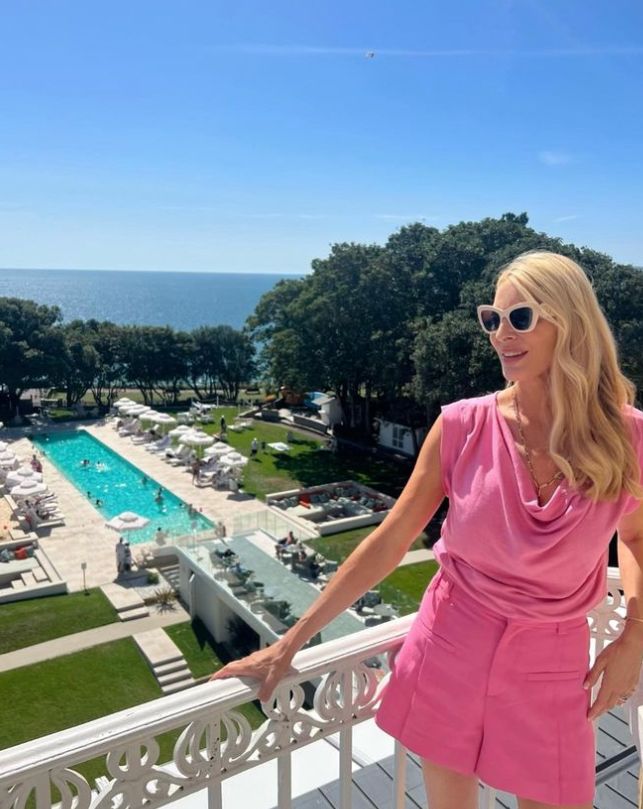 Tess Daly on a hotel balcony in a pink dress