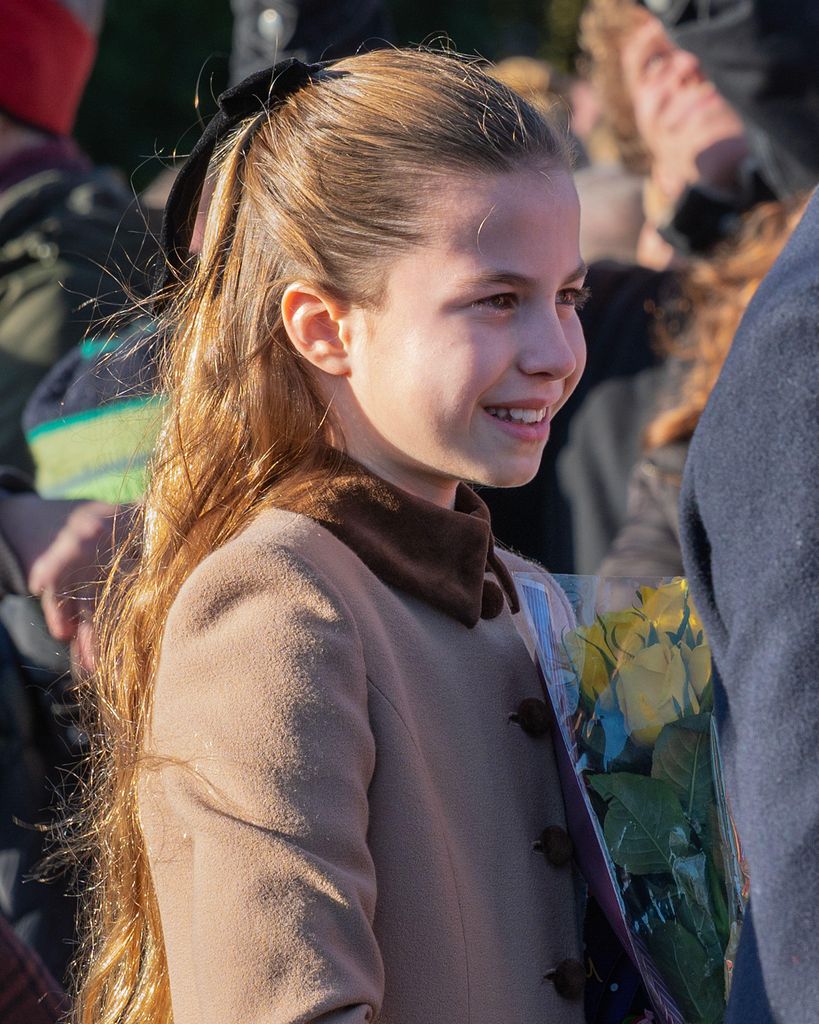 Princess Charlotte receives flowers from well-wishers on leaving St. Mary Magdalene Church 