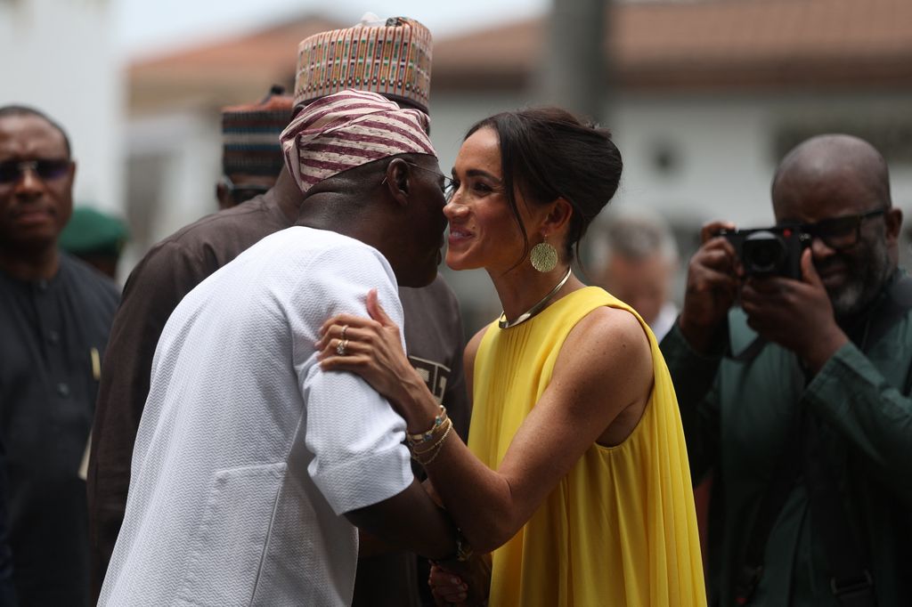 Lagos State Governor, Babajide Sanwo-Olu (L), welcomes Britain's Meghan (R), Duchess of Sussex