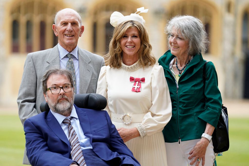 Kate Garraway with Derek Draper and her parents after being made an MBE 