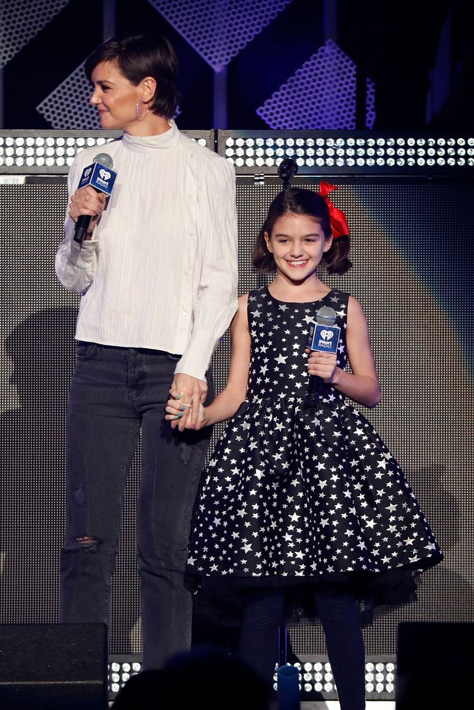 Suri Cruise with Katie Holmes on stage 