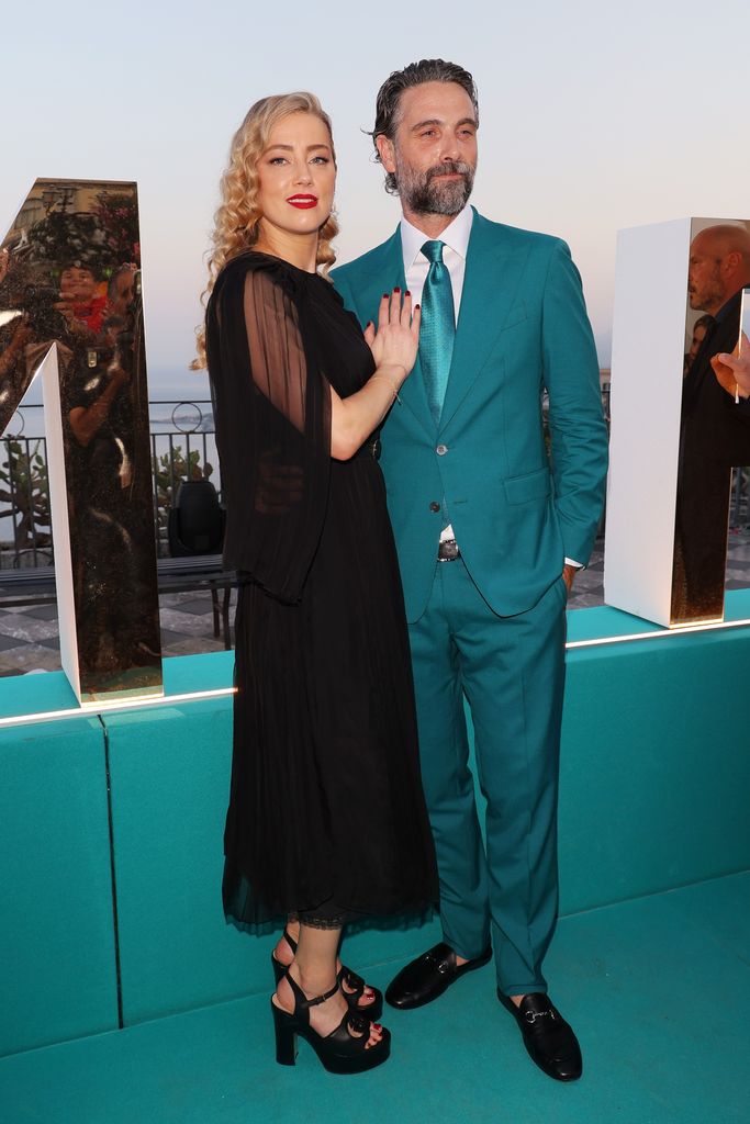 Amber Heard and Luca Calvani attend the 69th Taormina Film Festival on June 24, 2023 in Taormina, Italy