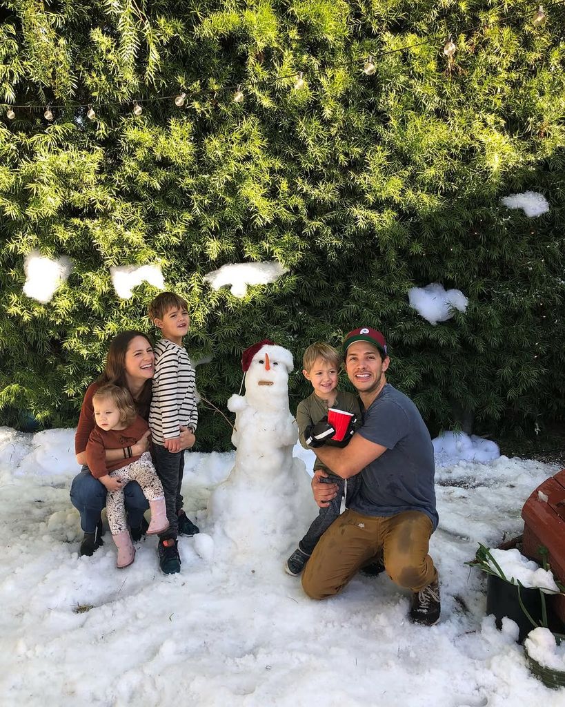 Michael Rady and wife Rachael pose with three of their children in 2017 in the snow