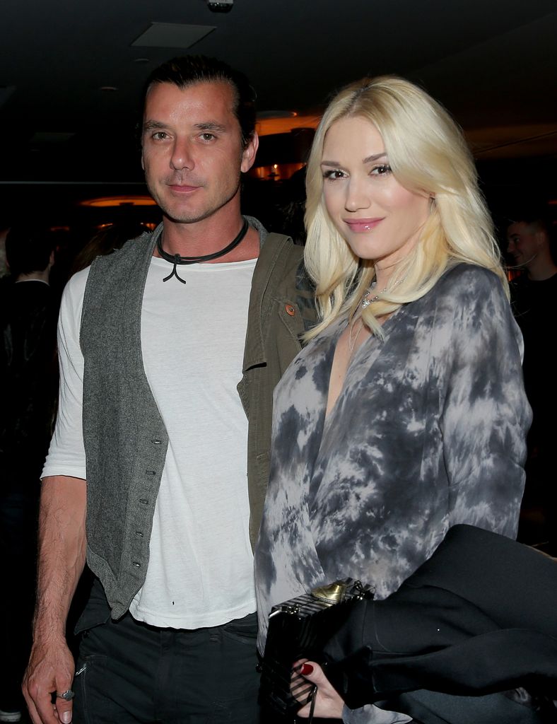 Musicians Gavin Rossdale (L) and  Gwen Stefani attend PANDORA Jewelry and Moto X present 'American Hustle' at cinema prive at  on November 30, 2013 in West Hollywood, California.