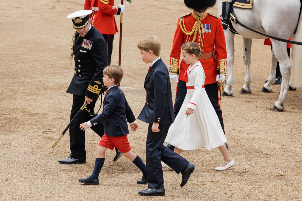 Prince Louis looked adorable in his red shorts as he walked alongside his siblings