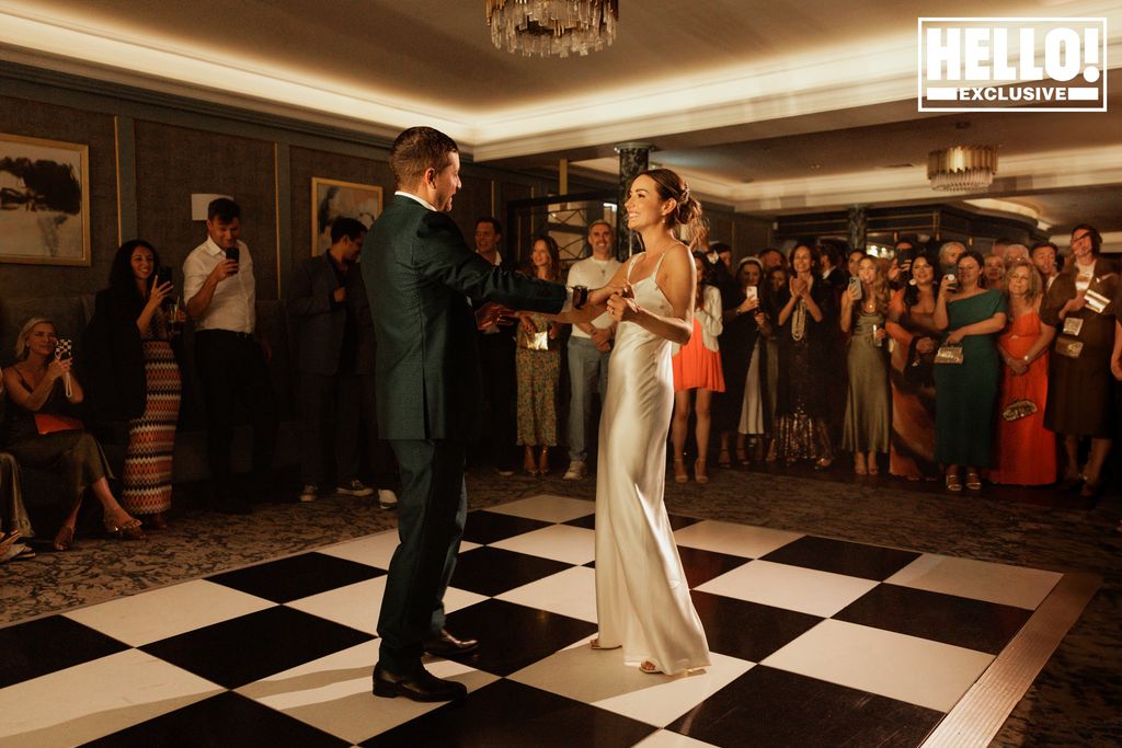 Faye Harris dances in a silky wedding dress with her husband Tyrone Wood