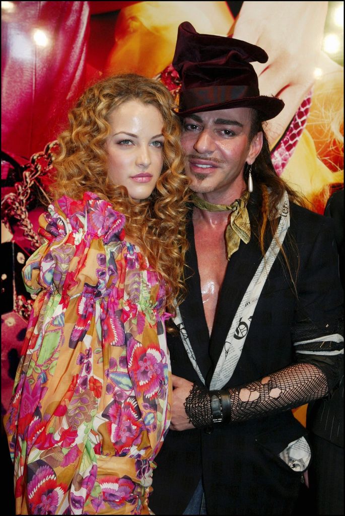 FRANCE - JULY 06:  People : Riley Keough (Daughter Of Lisa Presley), Designer John Galliano at the Christian Dior, Haute Couture Fashion Show Fall Winter 2004-2005 On July 6, 2004 In Paris, France