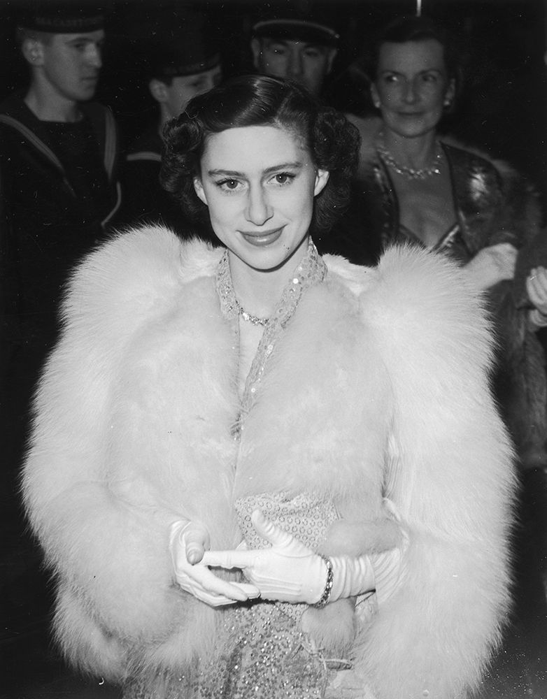 Princess Margaret wearing a sequin dress and fur coat in 1951