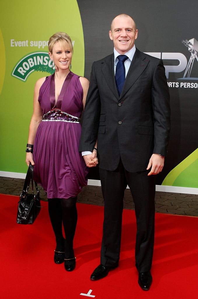 Zara in purple and Mike Tindall on red carpet 